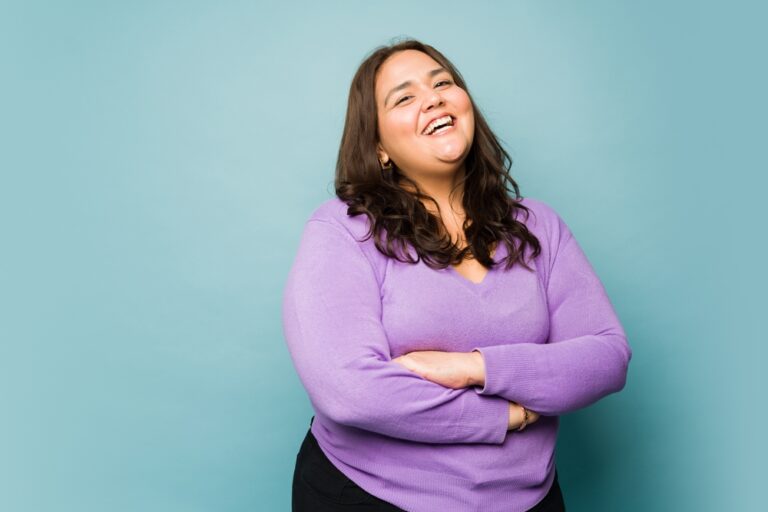 Obese Hispanic Woman Looking Excited While Laughing And Having Fun
